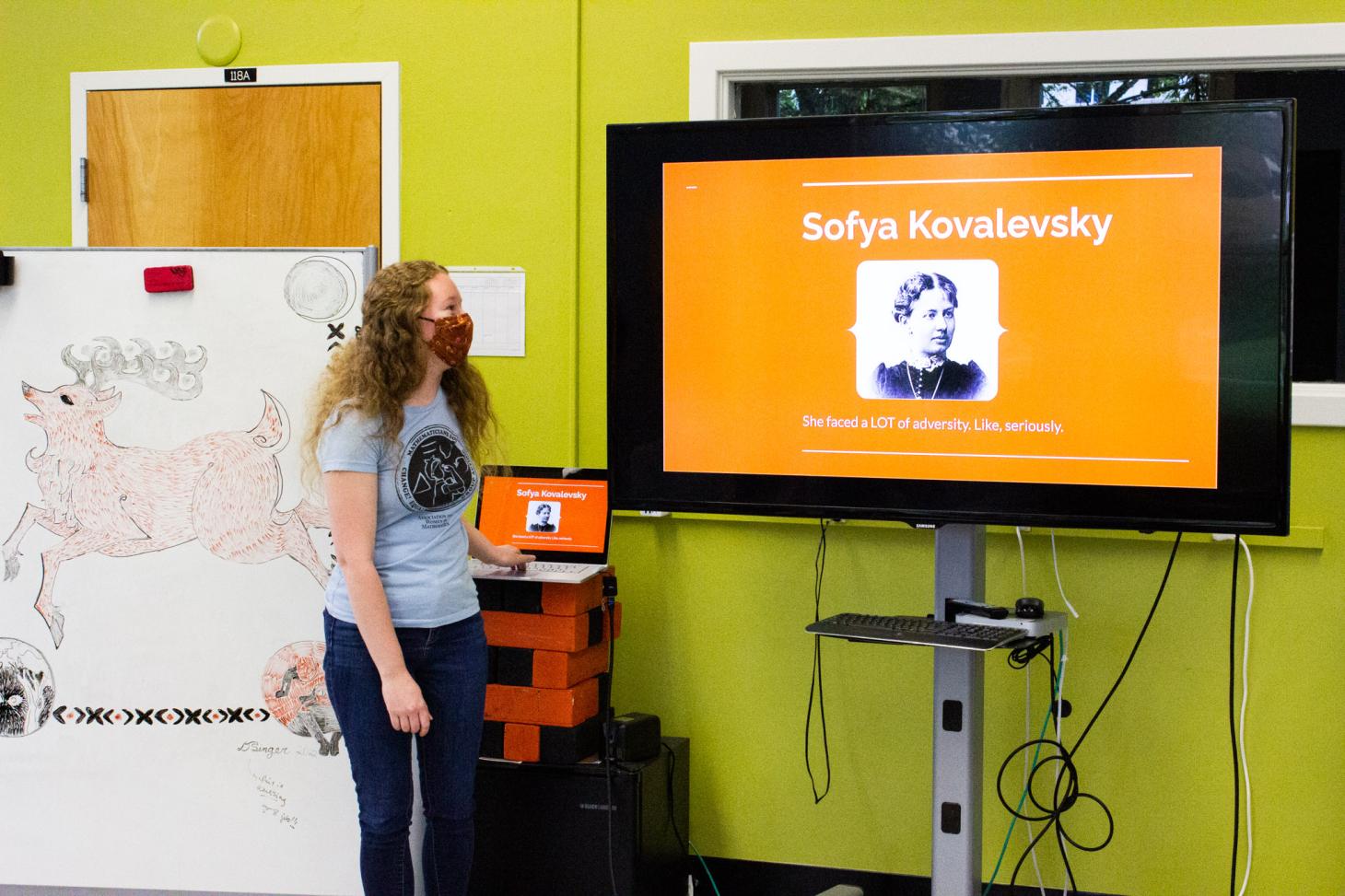 A member of the Association of Women in Mathematics presenting a powerpoint of Sofya Kovalevsky.