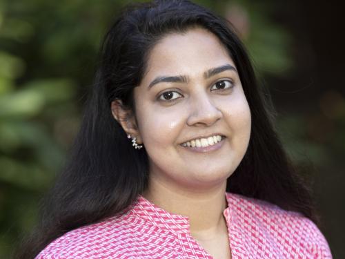 Headshot of Praveeni Mathangadeera smiling in a colorful shirt
